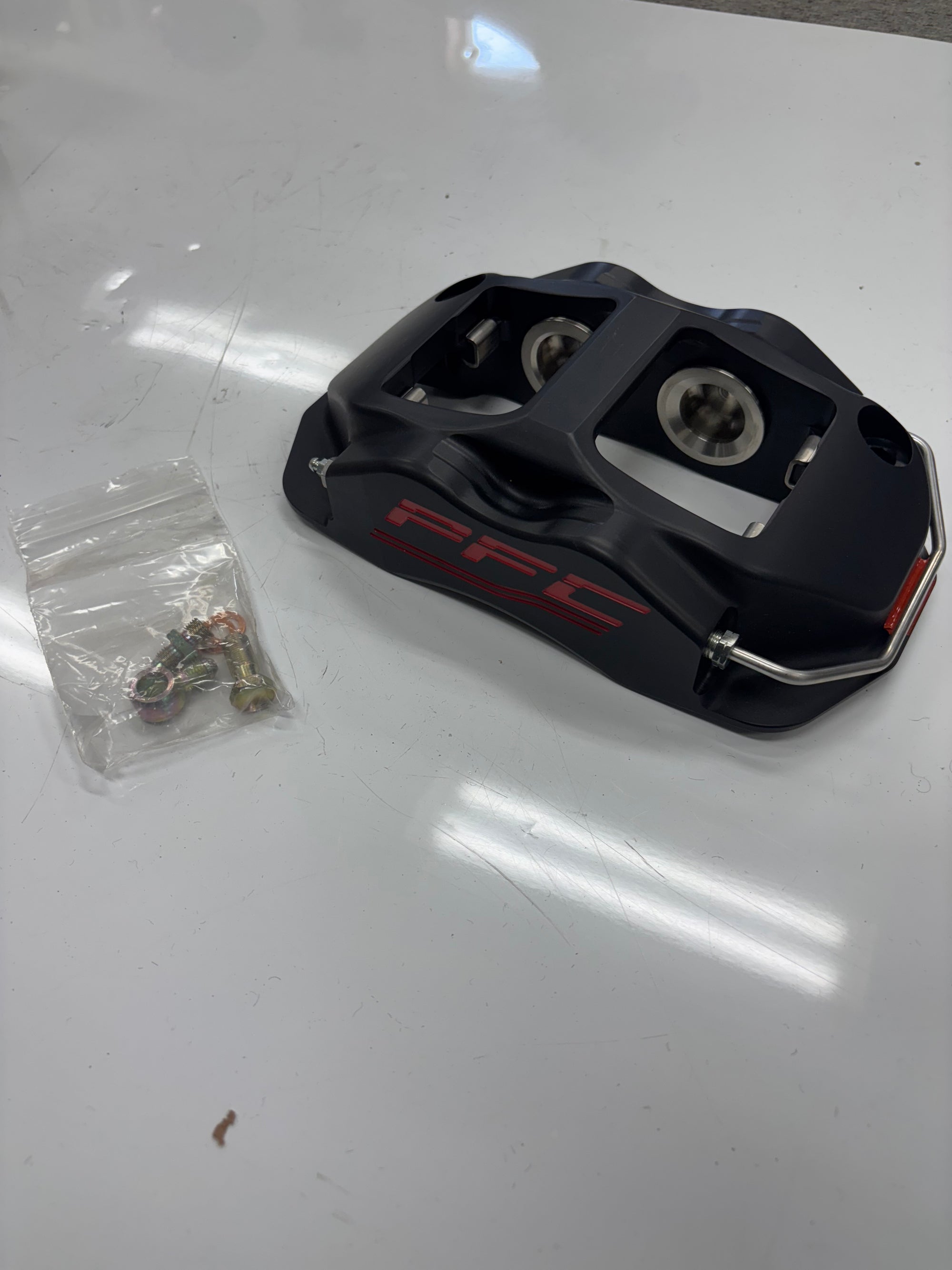 USED (NEW) PFC BRAKE CALIPER- BLACK